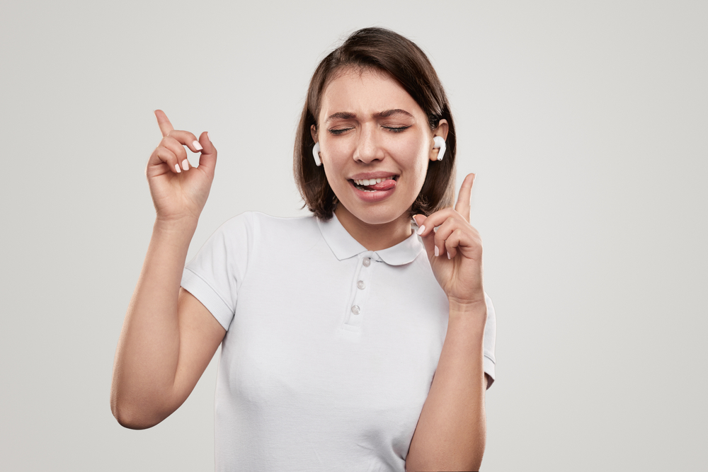 Happy woman with earbuds